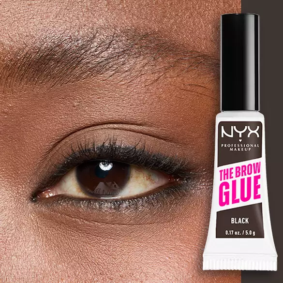 Close-up of an eye and brow with NYX Professional Makeup The Brow Glue Instant Brow Styler in Black shown beside the brow for a bold, brushed-up finish..